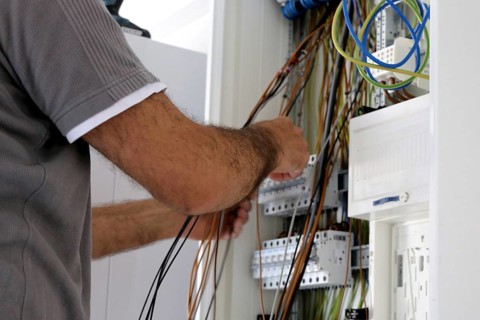 Professional electrical installation on a building shell