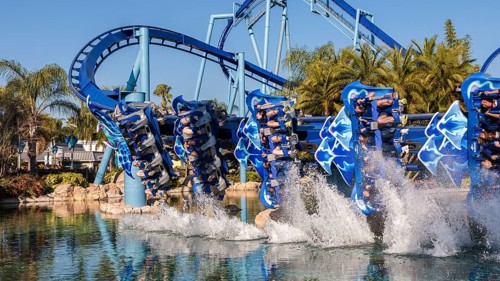 Manta roller coaster behind water splashes in lagoon at Sea World in Orlando, Florida, USA, North