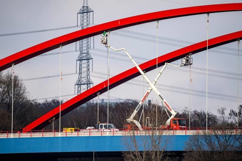 A42 motorway bridge, over the Rhine-Herne Canal, with massive structural damage, workers on lifting
