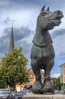 Prins, bronze statue of Brabant draft, draught horse by Belgian sculptor Koenraad Tinel at market