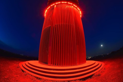 Red illuminated miner's light at night, Rheinpreußen spoil tip, Moers, Ruhr area, North