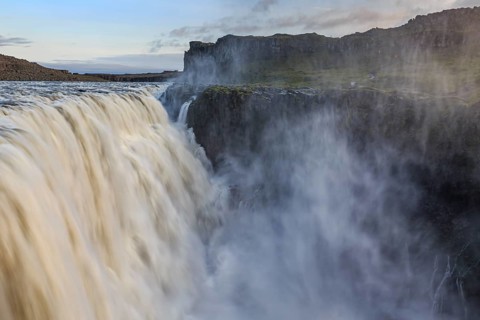 Large waterfall in a gorge, spray, rapids, summer, midnight sun, Dettifoss, North Iceland, Iceland,