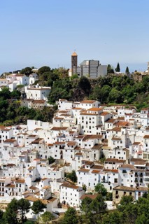 Typical white village of Casares, houses and church on a hill, View of the village, Route of the