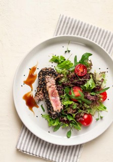 Vegetable salad, with fried tuna, in sesame seeds, healthy food, top view