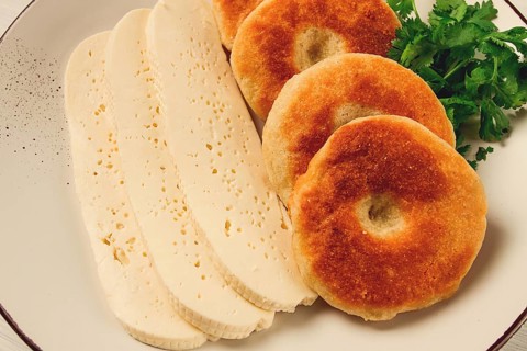 Mchadi, corn tortillas, traditional Georgian dish, corn bread, with Imeretian cheese, homemade, no