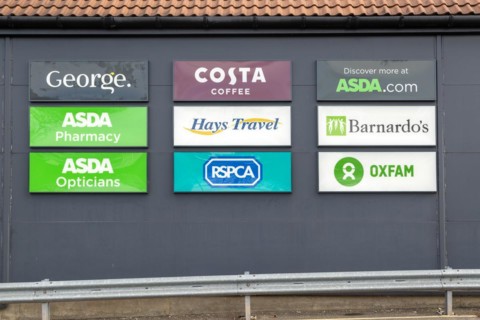 Signs for shops at the Meadow Centre, Stowmarket, Suffolk, England, UK