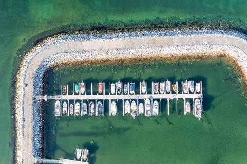 Aerial view of the marina at village Skaland, Senja island, Norway, Europe