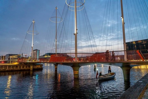 Cyclists on the Cirkelbroen cycle and pedestrian bridge, over the harbour, in the Christianshavens
