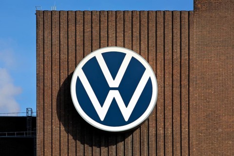 Large VW logo on the old cogeneration plant, Volkswagenwerk Wolfsburg, main plant of Volkswagen AG,