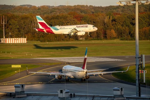 Eurowings Airbus A319-132, landing at Cologne-Bonn Airport, Eurowings Boeing 737-8GJ, waiting on