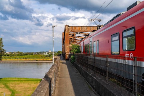The railway bridge Duisburg-Hochfeld-Rheinhausen, over the Rhine, regional trains and many goods