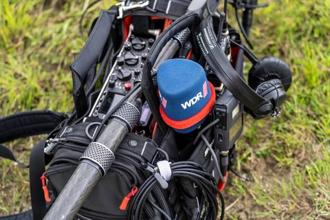 Symbolic image media, sound recorder, with microphones, sound boom, headphones, of a TV team of the