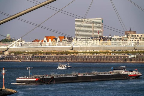 Cargo ships on the Rhine near Düsseldorf, bridge over the Media Harbour, Oberkassler Rhine Bridge,