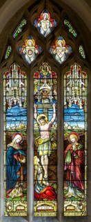 Stained glass window of Crucifixion church of Saint George, Ogbourne St George, Wiltshire, England,