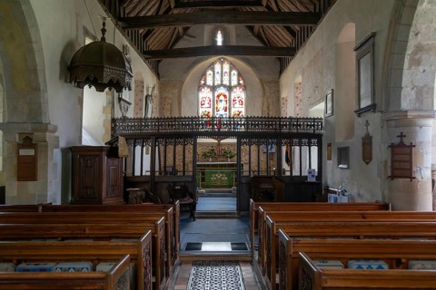 Interior of church of Saint Mary the Virgin, Silchester, Hampshire, England, UK view of nave, rood
