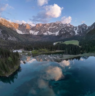 Aerial view of Lago Fusine with the Mangart massif in the background, Tarvisio, province of Udine,