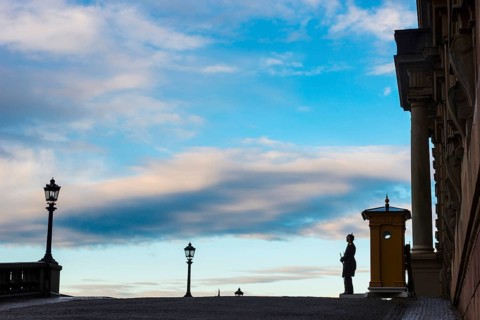 Silhouette of the royal palace in the evening sun, evening mood, guard, royal house, monarchy,