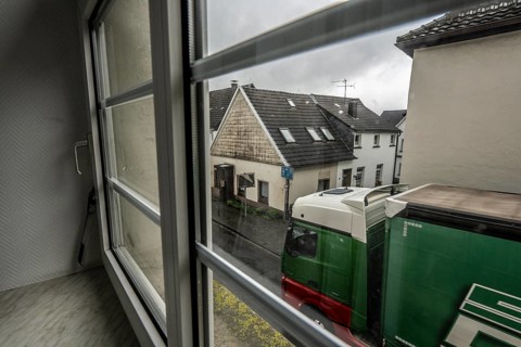 City centre traffic, lorry driving through the town of Breckerfeld, narrow passage in Frankfurter
