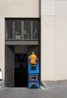 Construction worker with construction machine, Berlin, Germany, Europe