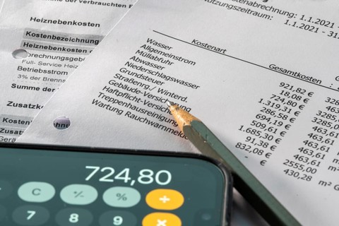 Symbolic image of service charge statement, heating cost statement, rental costs, list of