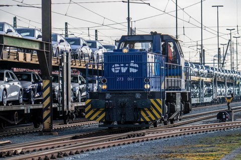 Car train, goods train on its way to the car terminal in Bremerhaven seaport, new German cars for