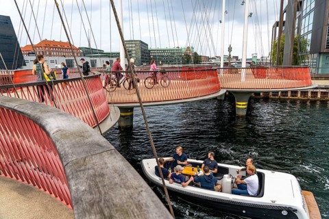 Cyclists on the Cirkelbroen cycle and pedestrian bridge, over the harbour, in the Christianshavens