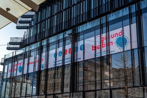 Information on corona, call to stay at home, illuminated sign, display at Kö-Bogen 2 building,