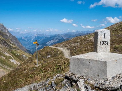Hiking path, pass petit col Ferret, border Switzerland-Italy, signposts, view towards Val de