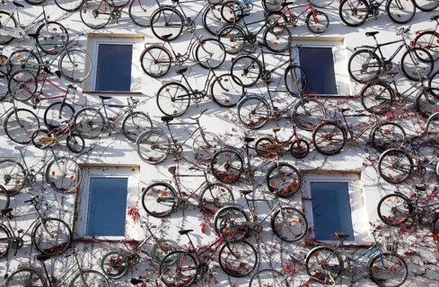 Bicycles are mounted on a house wall of a bicycle dealer, Altlandsberg, 19 October 2012,