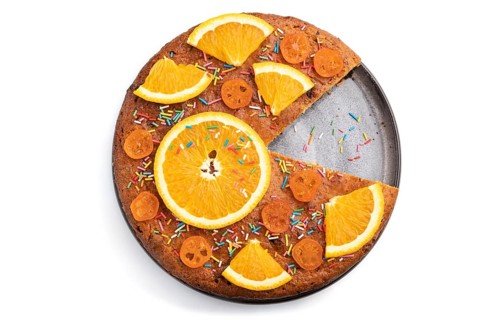Orange cake isolated on a white background. Top view, close up, flat lay