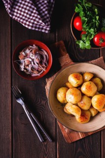 Fresh Cooked, new potatoes, with dill, on a wooden table, selective focus. close-up, toning, no