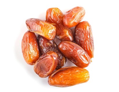 Pile of dried dates isolated on white background. tpo view