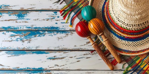 Mexico festive wooden background with sombrero, serape and maracas in flat lay view, AI generated