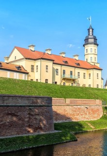 Ancient restored castle with a moat in the Nesvizh city. Belarus
