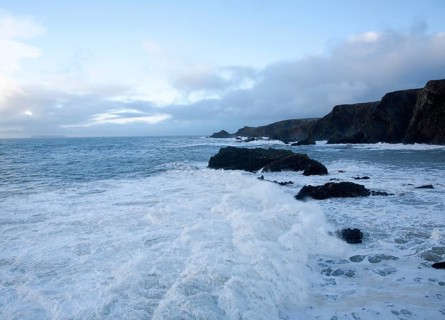Large Atlantic storm waves crashing onto jagged rocky coast at Hartland Quay, north Devon, England,