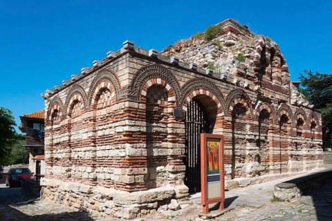 Historic church ruins made of red bricks under a clear blue sky, Church of the Holy Archangels