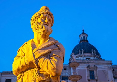 Statue of Praetorian Fountain and the dome of Santa Caterina church by night, Piazza Pretoria,
