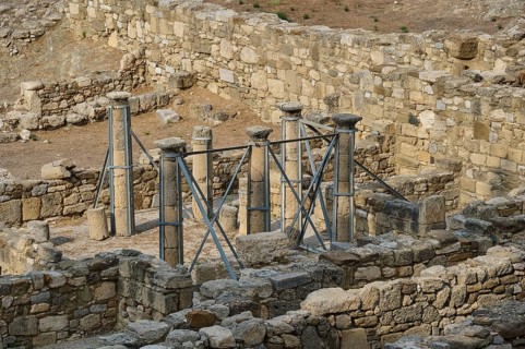 Archaeological site with ruins and stone columns in the open air, Atrium house, Kamiros,