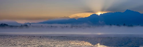 Sunrise at Lake Hopfensee near Füssen, behind Hopfen am See, the Tegelberg massif and the Säuling,