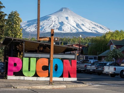 Street in center of Pucon, volcano Villarica in the back, La Auracania, Chile, South America