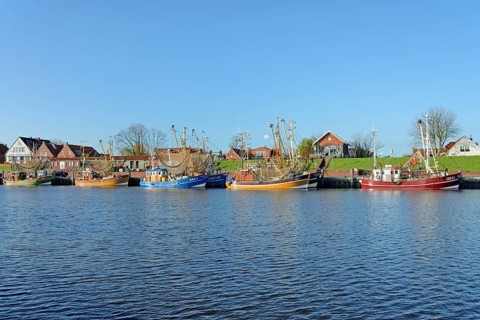 Crab cutter in the harbour of Greetsiel, blue sky, North Sea, Lower Saxony, Germany, Europe