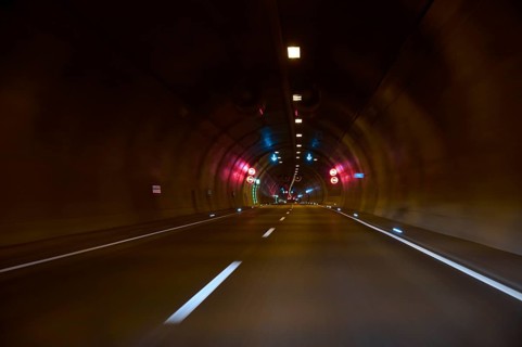 Motorway tunnel A71 with illuminated road and modern light installations offering a perspective