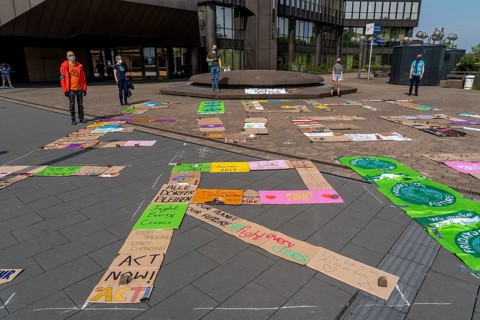 Friday For Future activists with the action, Your sign strikes for you, collected protest signs are