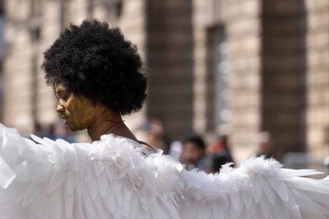 Street performers with angel wings, world's largest cultural festival The Fringe, High Street,