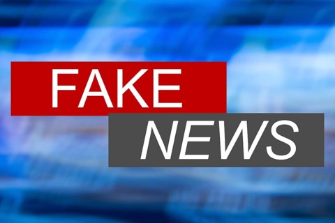Symbolic image of fake news: The screen of an imaginary news programme shows the words fake news