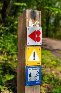 Signpost on the Brammentrail, mountain bike trail on the Schurenbach spoil tip, in Essen North