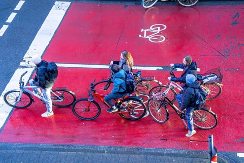 Cycle lane, space for cyclists at a traffic light crossing, marked red, cars, lorries must stop