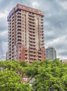 Red-brown building in the center of Kuala Lumpur, Malaysia, Asia