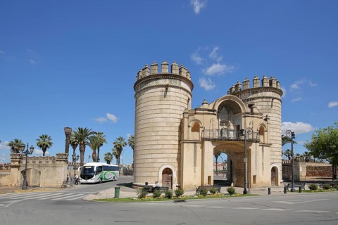 Historic archway with two towers built in 1551 at the Puerta de Palmas bridge and coach, Badajoz,