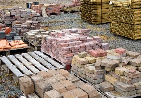 Clay bricks piled up in builder's yard, UK